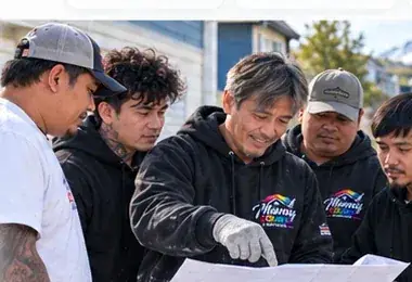 Manny Colors team discussing work onsite